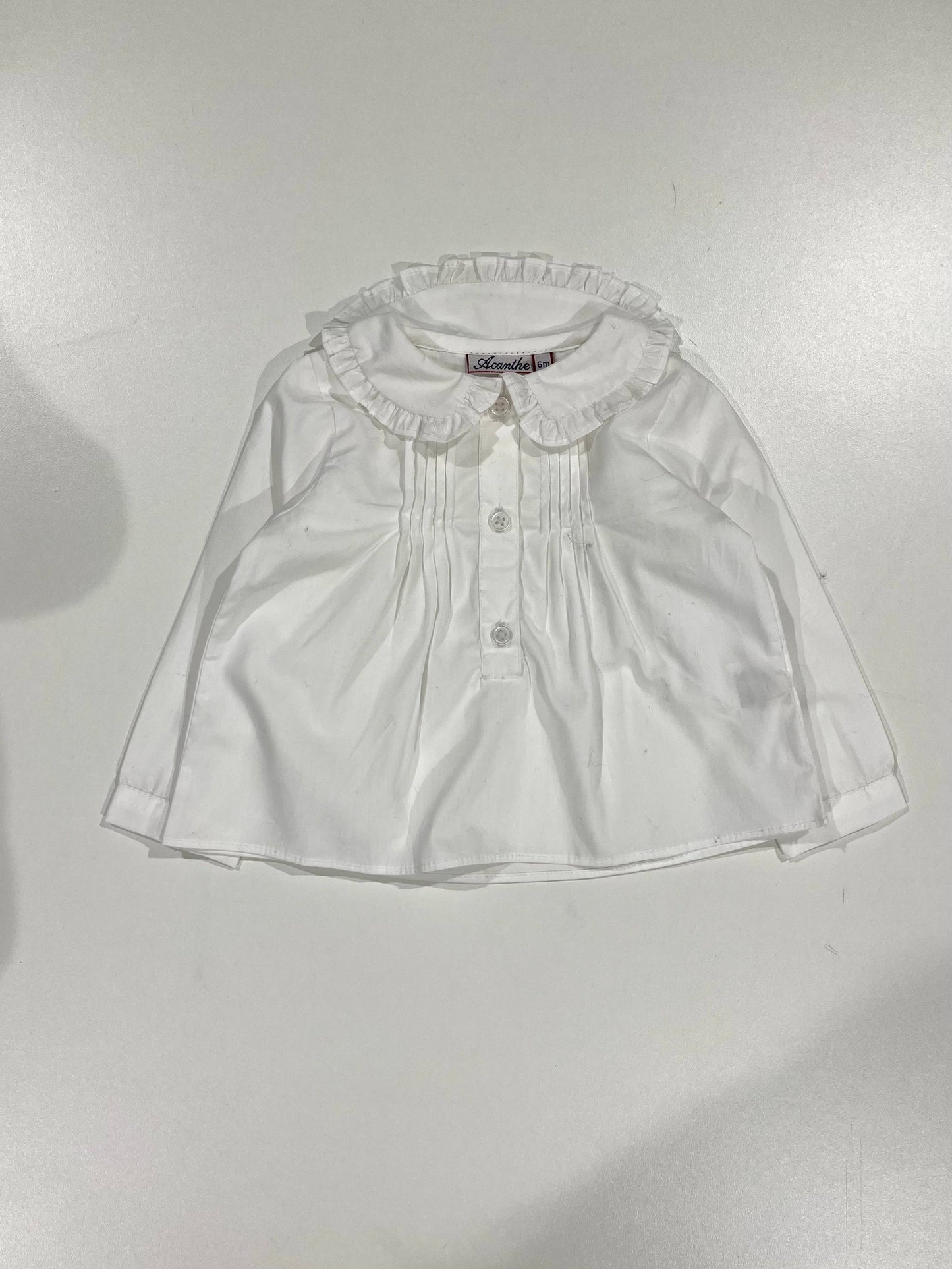 Blouse avec encolure petits volants